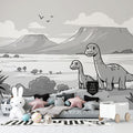 Black and white dinosaur mural wallpaper styled in modern kids bedroom with minimalist furniture and natural light