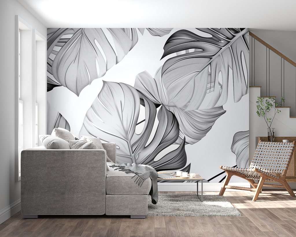 Black and white Monstera wall mural creating a focal point in a minimalist bedroom