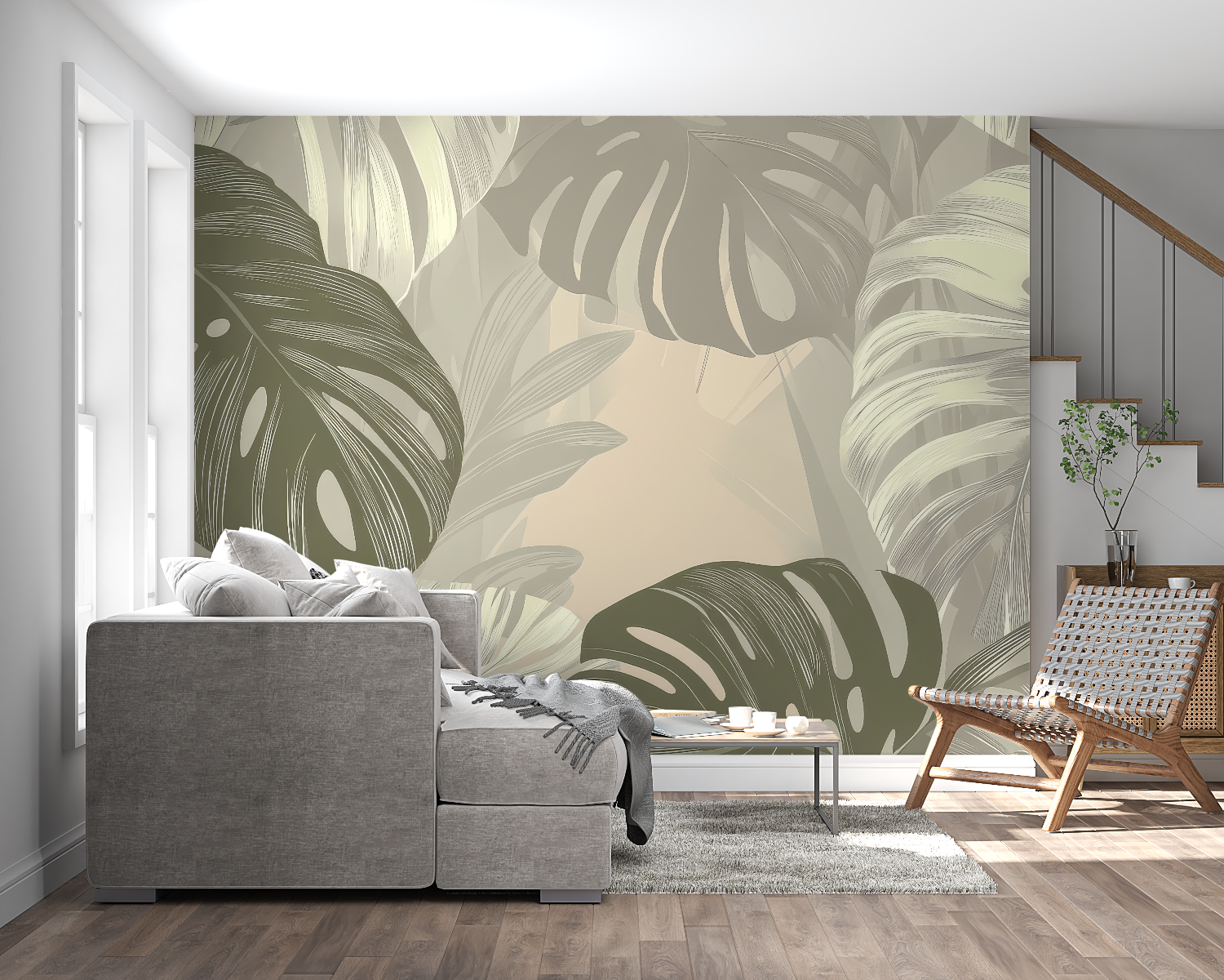 Botanical wall mural with monstera leaves in a home office setting with natural light