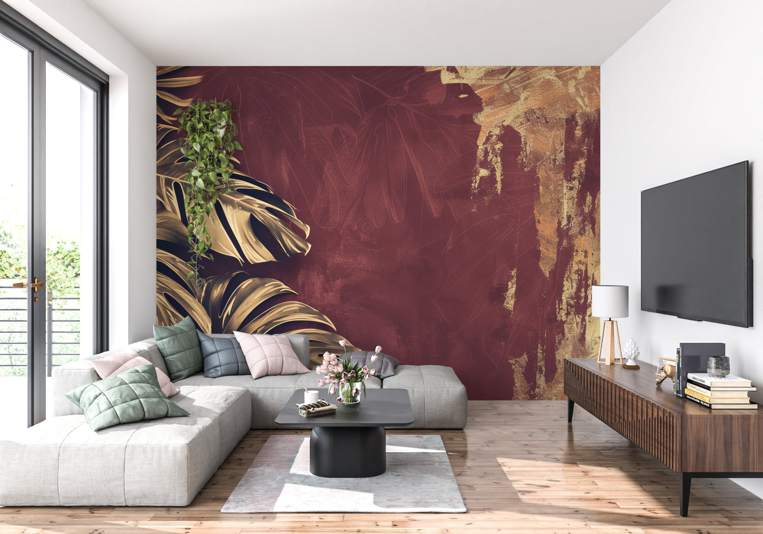 Tropical wall mural bringing warmth to hallway with golden monstera leaves on deep burgundy