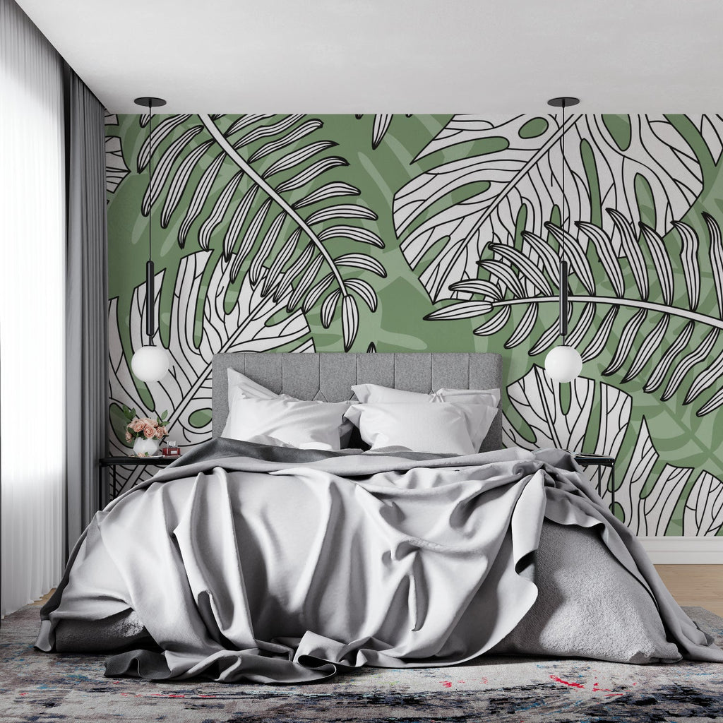 Home office featuring green and white Monstera wall mural adding natural calm