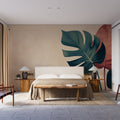 Modern Monstera leaf wallpaper creating a bold statement wall in a bright dining room with minimal furniture