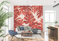 Modern living room with Monstera leaf wallpaper in terracotta creating a warm, inviting atmosphere