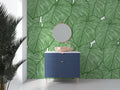 Modern living room with Monstera leaf wallpaper creating a fresh tropical atmosphere