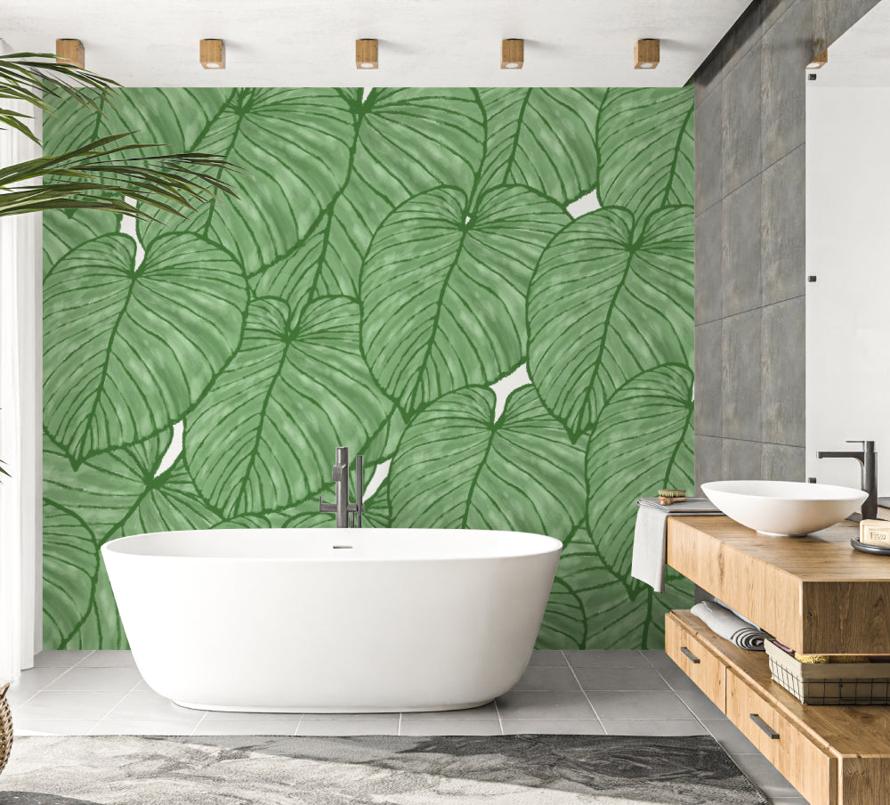 Bedroom showcasing green Monstera wallpaper creating a peaceful retreat