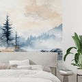 Mountain forest wallpaper creating depth in modern living room with gray sofa and natural light