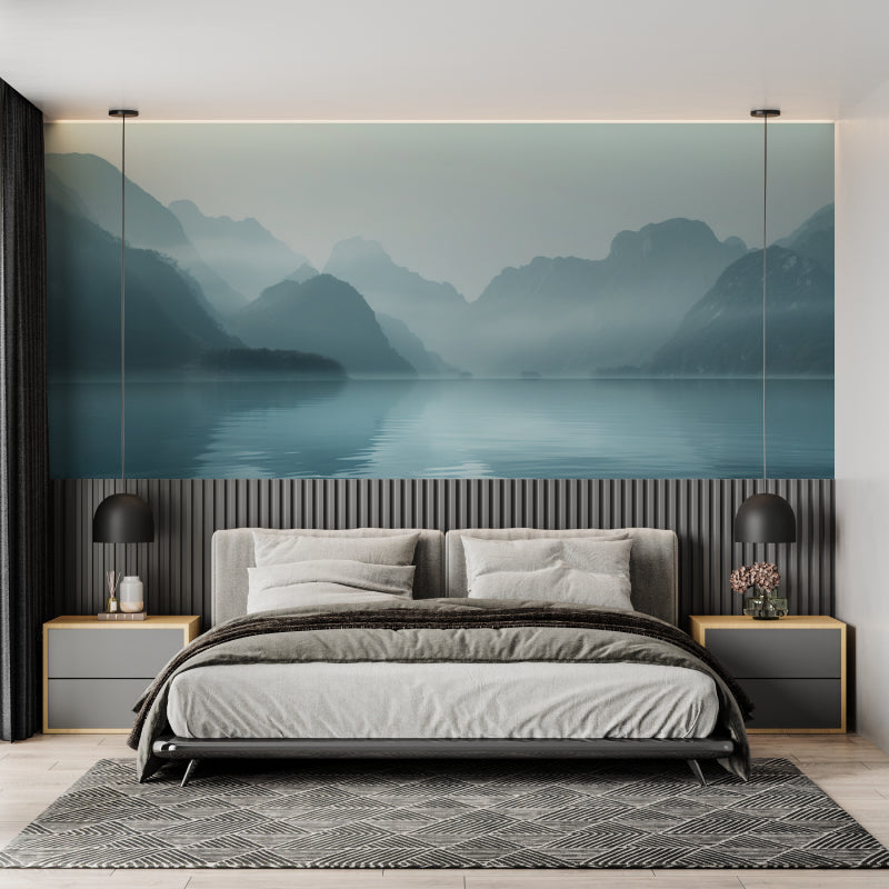 Mountain lake wallpaper creating depth in modern living room with grey sofa