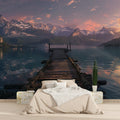 Mountain lake wallpaper in modern living room showing wooden pier extending into calm waters at sunset