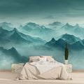Mountain mist wallpaper creating depth in modern living room with grey sofa and natural light