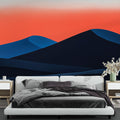 Modern Mountain Mural Wallpaper creating depth in a minimalist living room with abstract sunset colors and geometric peaks
