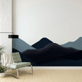 Modern mountain wallpaper with blue wave patterns shown in a minimalist living room setting with contemporary furniture