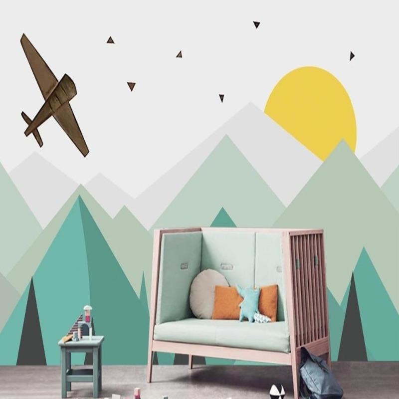 Mountain adventure wallpaper in bright kid's bedroom showing geometric peaks and flying aircraft