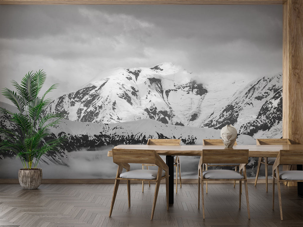 Black and white mountain wallpaper in minimalist bedroom setting with wooden furniture