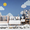 Mountain nursery wallpaper creating a cozy atmosphere in a modern nursery with white furniture