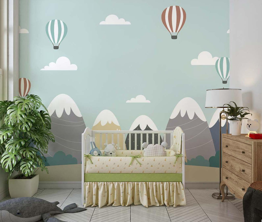 Kids bedroom featuring mountain peaks wallpaper with floating hot air balloons