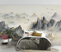 Japanese mountain mural wallpaper in modern minimal living room, creating serene atmosphere with misty peaks and birds