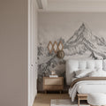 Black and white mountain mural wallpaper in modern minimalist living room creating dramatic focal point