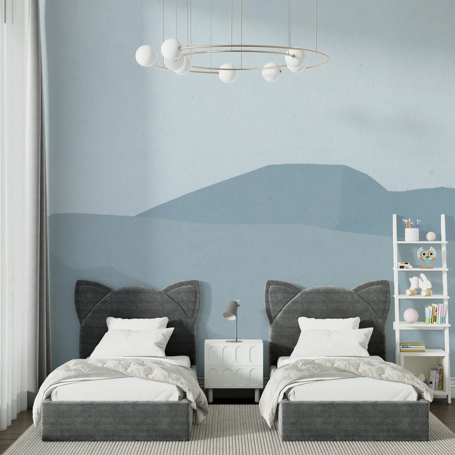 Blue mountain wall mural in child's nursery with simple furniture