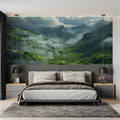Mountain landscape wallpaper creating depth in modern living room with grey sofa and natural light