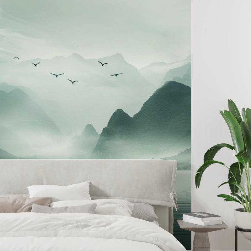 Peaceful bedroom with mountain landscape mural featuring morning mist and soaring birds