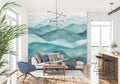 Mountain mural wallpaper creating depth in modern living room with minimal furniture
