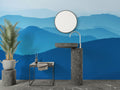 Mountain wall mural in modern living room showing blue gradient peaks creating depth