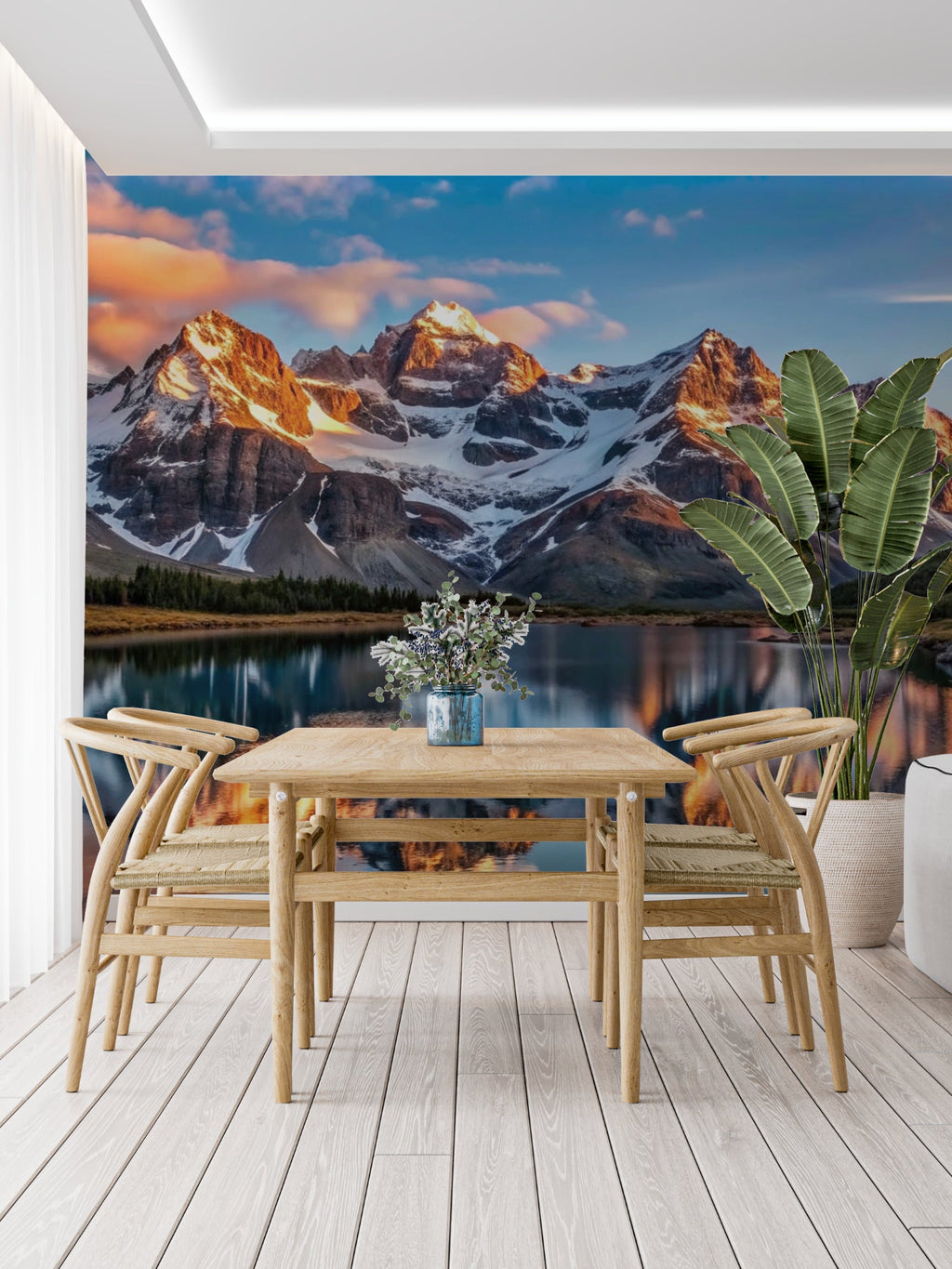 Mountain landscape wallpaper creating depth in modern living room with minimal furniture