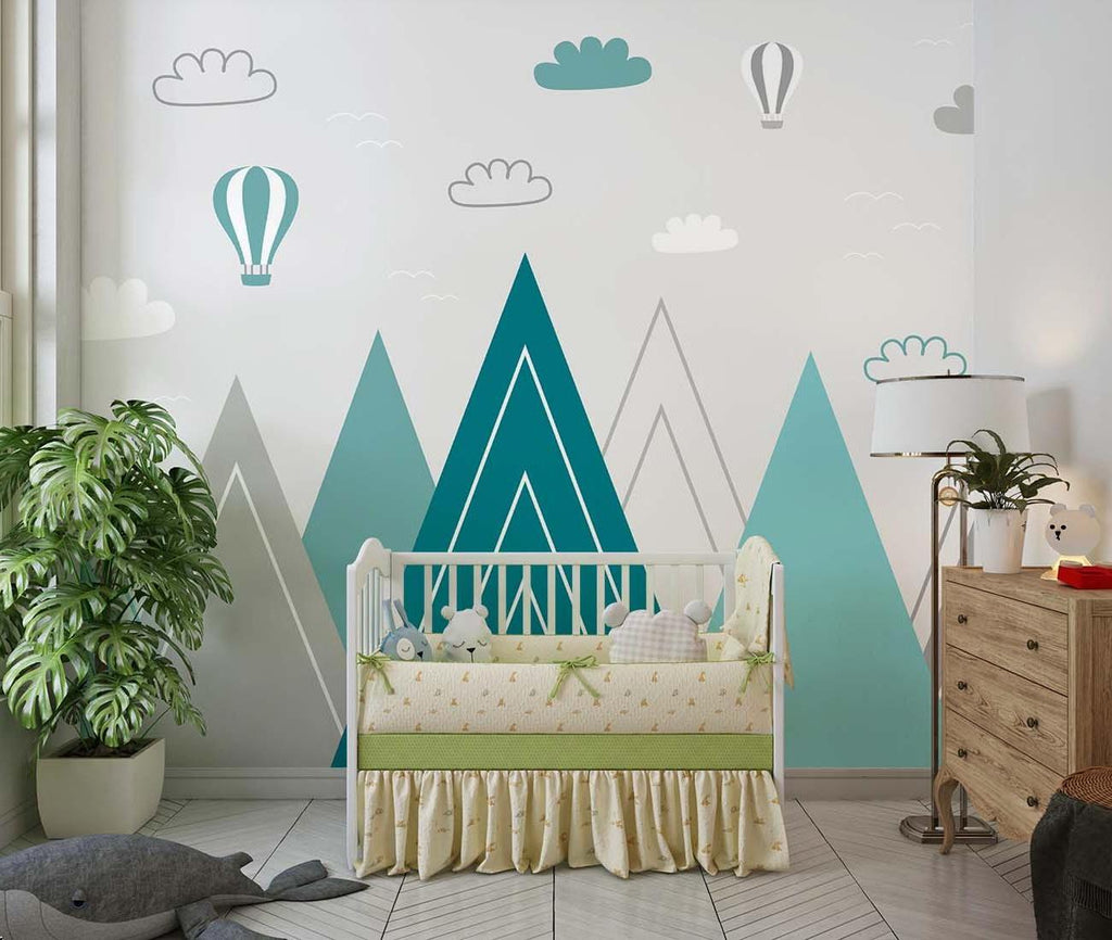 Mountain nursery wallpaper with hot air balloons shown in a bright modern nursery with white furniture