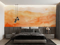 Mountain sunset mural wallpaper in modern living room showing orange and beige tones