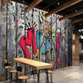 Music graffiti wallpaper bringing urban style to a modern teen bedroom with bright wall lighting
