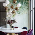 Botanical wallpaper with watercolor leaves creating a calm atmosphere in a modern living room