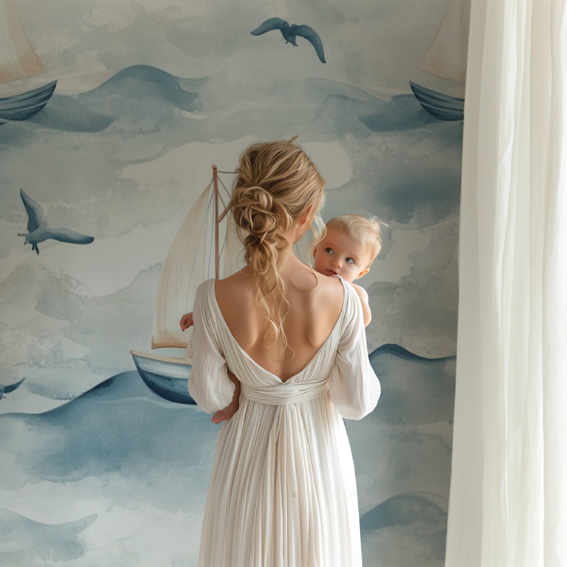 Seaside wall mural featuring gentle waves and sailboats in a cozy nursery setting