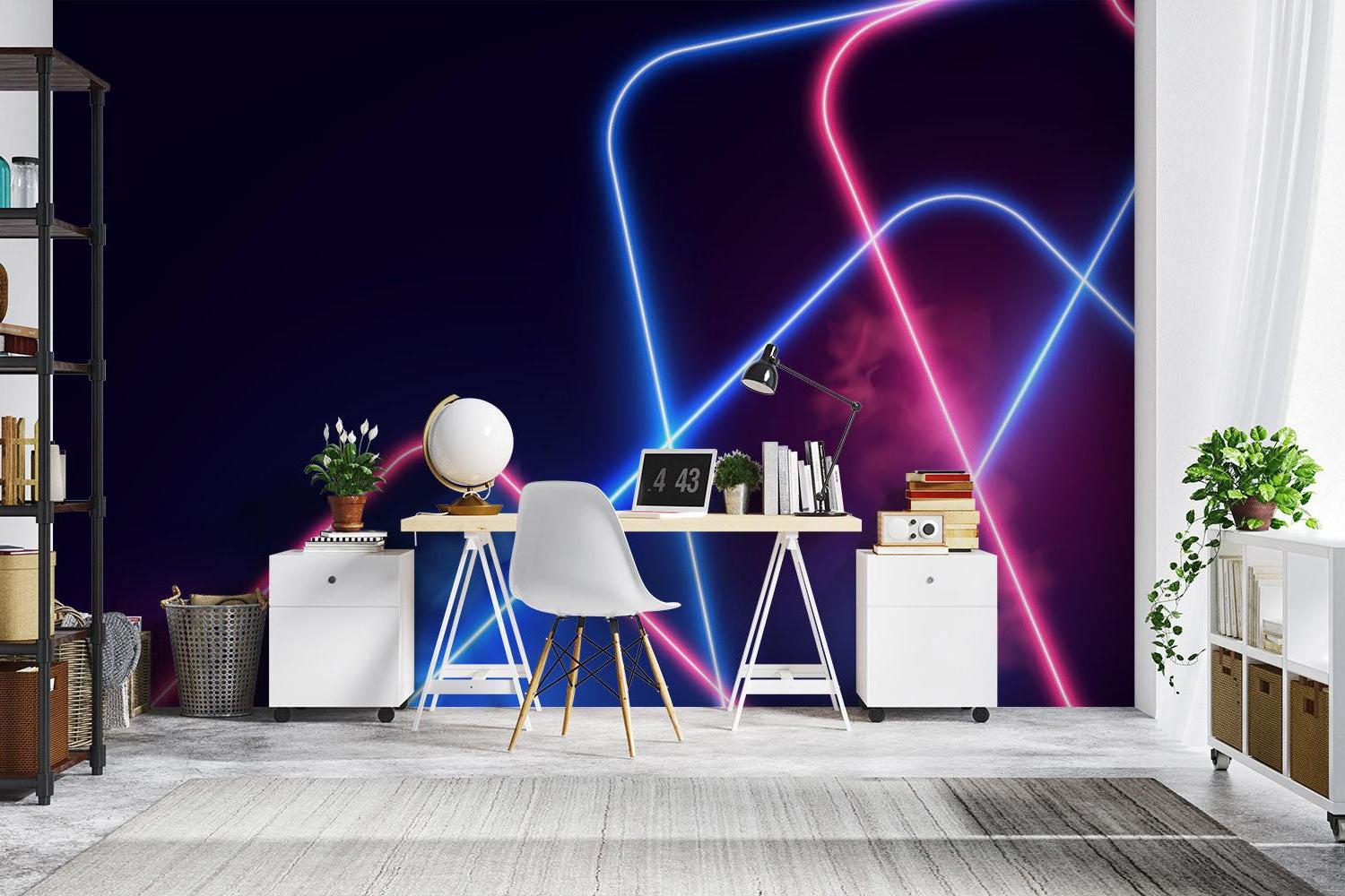 Modern neon geometric wallpaper in a gaming room setup with RGB lighting effects