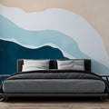 Modern living room featuring Ocean Wave Abstract Wallpaper creating a serene coastal atmosphere with flowing teal and beige tones