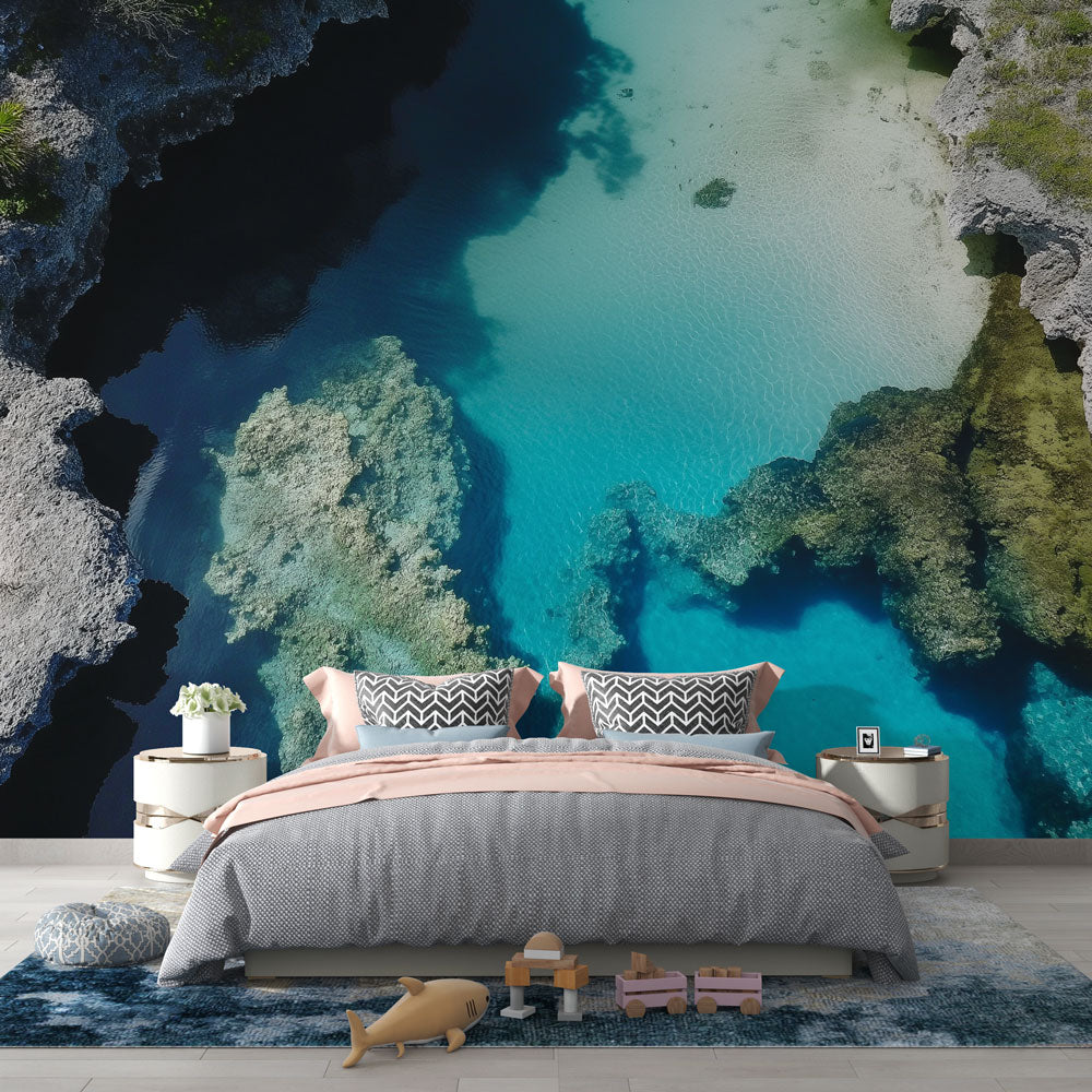 Ocean view wallpaper creates a bright, airy feel in modern living room with white furniture and natural light