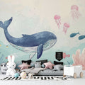 Ocean theme wallpaper creating a peaceful nursery atmosphere with gentle whale and jellyfish design