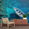 Mediterranean sea wallpaper creating a bright, airy atmosphere in a modern living room with coastal decor