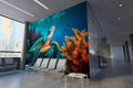 Sea turtle wallpaper mural showcased in a modern living room, creating an underwater atmosphere with soft blue tones