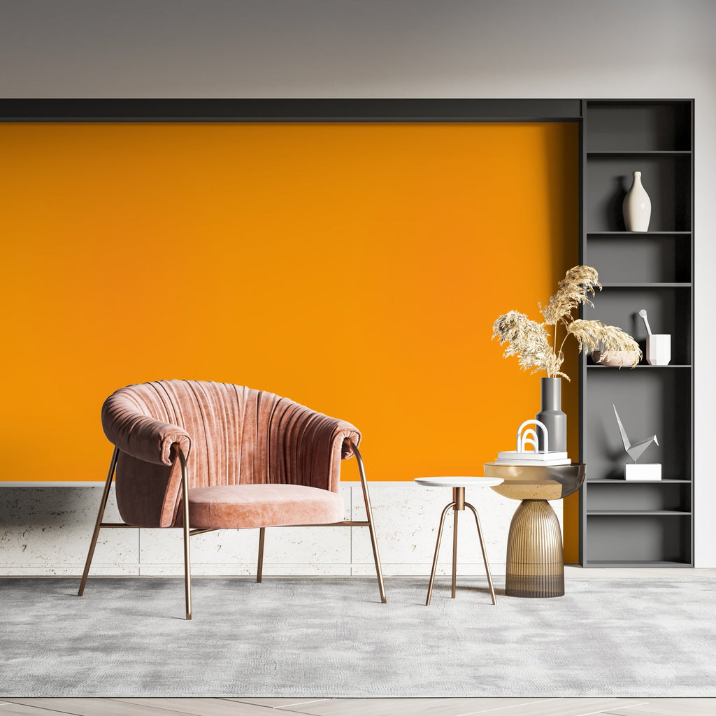 Contemporary home office featuring vibrant orange wallpaper with minimalist desk setup