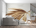 Golden palm leaf wallpaper mural creating a peaceful atmosphere in a modern living room with natural light