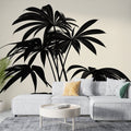 Modern living room featuring black Palm Leaves Mural Wallpaper, showing dramatic tropical silhouettes against soft beige background