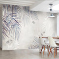 Palm leaves wallpaper in modern grey living room creating serene atmosphere