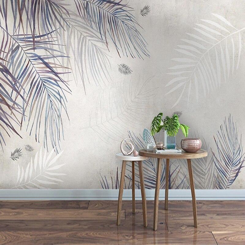 Grey and blue palm wallpaper in home office space showing scale