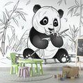 Panda wallpaper mural in a modern nursery with white furniture and natural light showing the peaceful black and white design