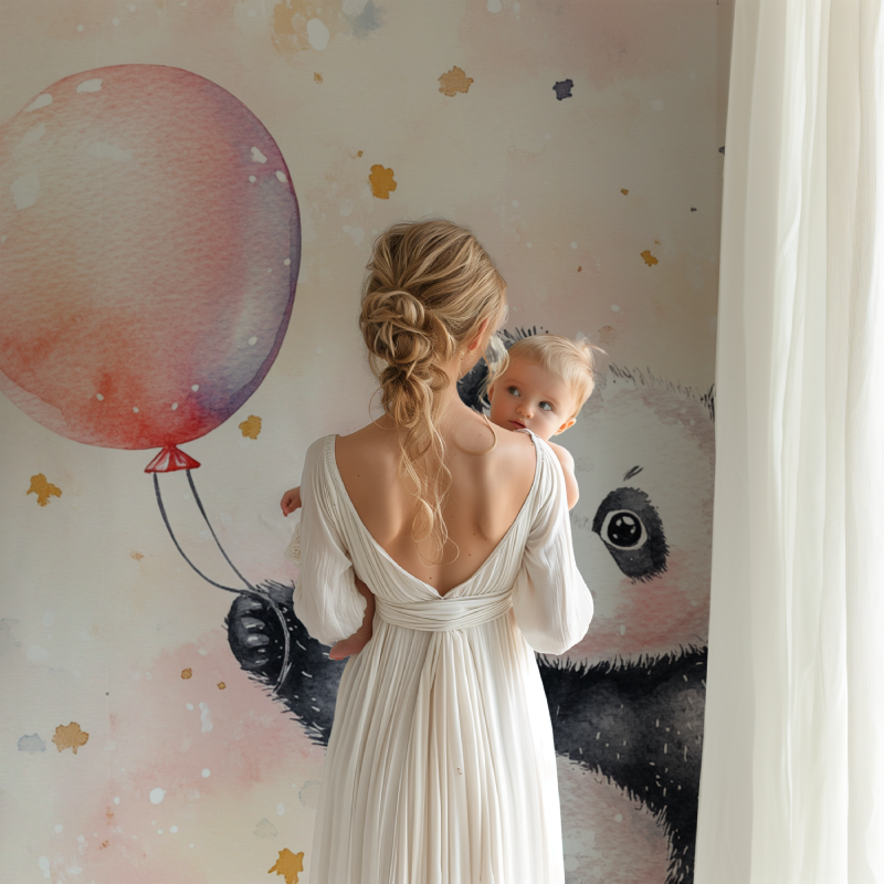 Pink Panda Wallpaper creating a dreamy atmosphere in a modern nursery with white furniture