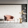 Gold dot wallpaper in bright modern living room, showing pattern sparkle in natural light