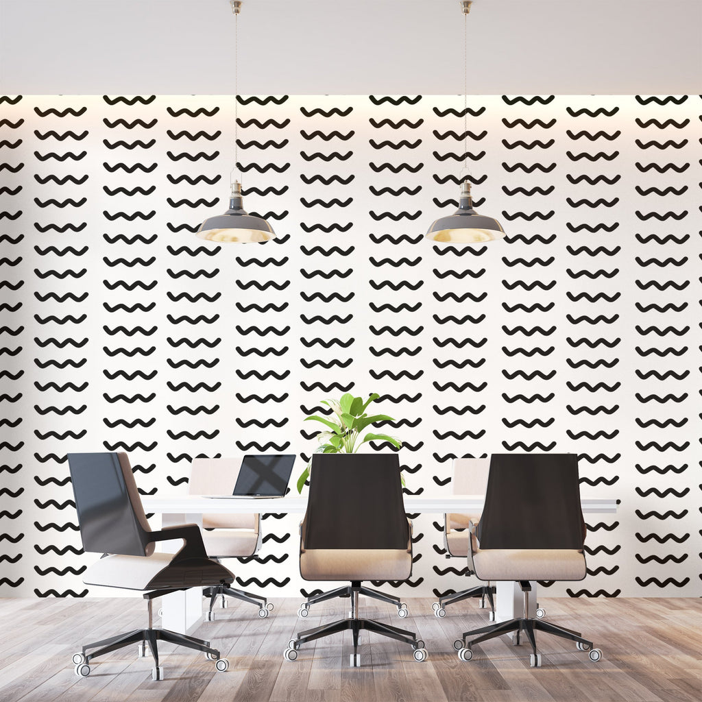 Modern wave pattern wallpaper creating movement in a minimal living room with white sofa and black accents