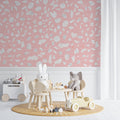 Pink terrazzo pattern wallpaper creating a modern accent wall in a bright living room