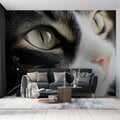 Black and white cat portrait wallpaper creating a dramatic focal point in a minimalist living room with natural lighting