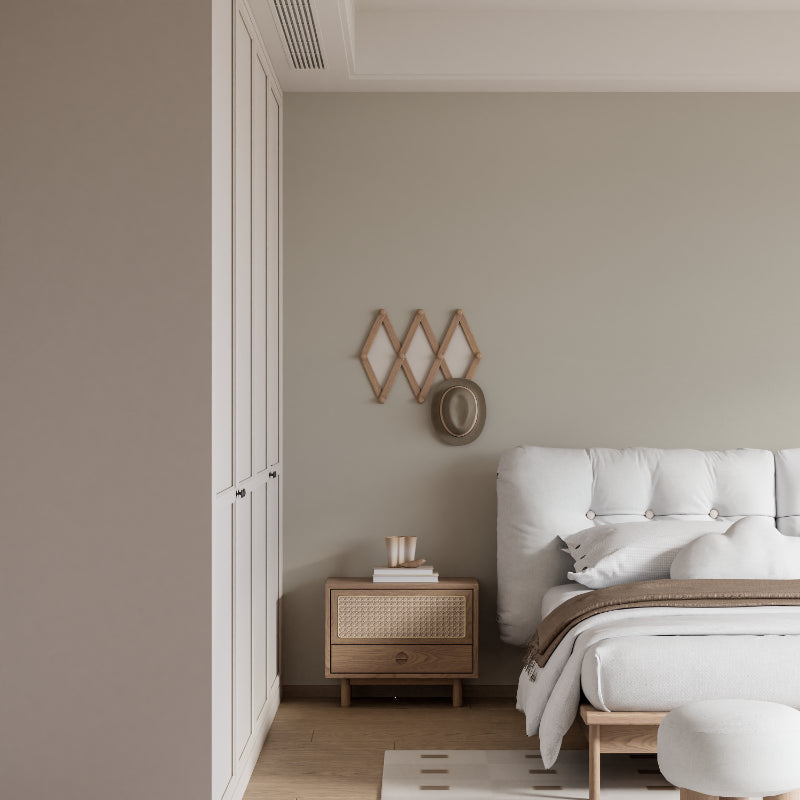Neutral wallpaper bringing warmth to entryway with simple decor elements